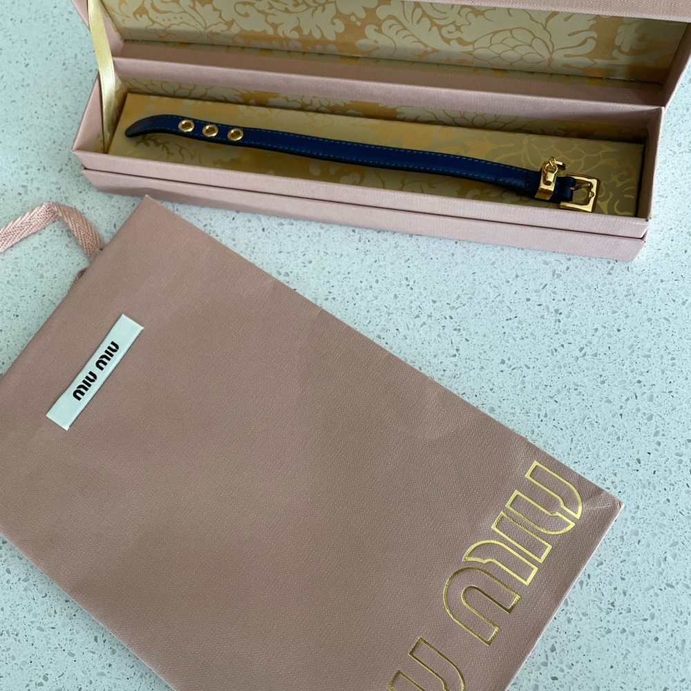 Brand new AUTHENTIC Miu Miu Prada leather bracelet in navy with gold hardware.